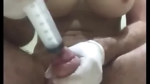 Insertion condom into bladder with pumped balls plus fake titts