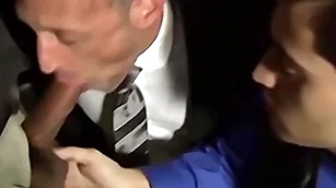 Bald bearded stud sucking several cocks adjacent to an orgy