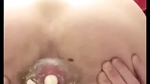 Cute teen pushes boiled egg get a kick from his ass